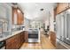Spacious kitchen featuring stainless steel appliances, wood cabinets, and granite countertops at 534 S Pearl St, Denver, CO 80209