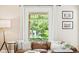 Living room showcasing a decorative window with natural light, comfortable couch, and stylish decor at 534 S Pearl St, Denver, CO 80209