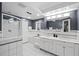Luxurious bathroom with glass shower, soaking tub, and double vanity with marble countertops at 2684 Taft Ct, Lakewood, CO 80215