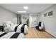 Cozy bedroom with hardwood floors, skylight, and comfortable furnishings at 2684 Taft Ct, Lakewood, CO 80215