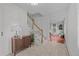 Inviting entryway with tiled floors, wood accents, and a staircase leading to the upper level at 2684 Taft Ct, Lakewood, CO 80215