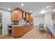 Spacious kitchen features wooden cabinets, stainless steel appliances, and a cozy breakfast area for casual dining at 2684 Taft Ct, Lakewood, CO 80215