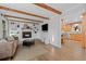 Open-concept living room with a fireplace, built-in shelves, and access to the kitchen, great for gatherings at 2684 Taft Ct, Lakewood, CO 80215