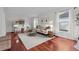 Bright living room featuring hardwood floors, neutral paint, large windows, and stylish furnishings at 2684 Taft Ct, Lakewood, CO 80215