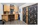 Well-organized shed interior with custom cabinets, a desk, and ample workspace at 2684 Taft Ct, Lakewood, CO 80215
