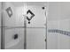 Contemporary shower featuring glass door, mosaic tiling accents and a built-in seat at 2684 Taft Ct, Lakewood, CO 80215