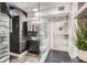 Unique bathroom featuring a glass shower, modern vanity, and rustic wooden paneling at 4400 S Quebec St # 101N, Denver, CO 80237