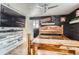 Spacious bedroom with wooden furniture, dark wood paneling, and a textured metal ceiling at 4400 S Quebec St # 101N, Denver, CO 80237