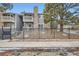 Charming condo with a stone facade, private balconies and a decorative iron fence for enhanced curb appeal at 4400 S Quebec St # 101N, Denver, CO 80237