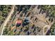 Aerial view of house with a red roof, complemented by the surrounding desert landscape at 319 Camino Bosque, Boulder, CO 80302