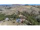 Stunning aerial view showcasing multiple homes nestled into a mountainside landscape at 319 Camino Bosque, Boulder, CO 80302