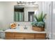 Bathroom features a neutral vanity, decorative accents, and a large mirror at 319 Camino Bosque, Boulder, CO 80302