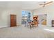 Dining room featuring vaulted ceilings, carpet, access to deck, and an adjacent kitchen at 319 Camino Bosque, Boulder, CO 80302