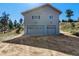 Two-story house with a two-car garage with a gravel driveway at 319 Camino Bosque, Boulder, CO 80302