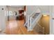Hallway view with staircase and hardwood flooring leading into the kitchen at 319 Camino Bosque, Boulder, CO 80302