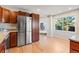Bright kitchen with stainless steel appliances, granite countertops, and hardwood floors at 319 Camino Bosque, Boulder, CO 80302