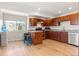 Stylish kitchen featuring granite countertops, wood floors, stainless steel appliances and an adjacent breakfast bar at 319 Camino Bosque, Boulder, CO 80302