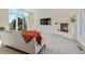 Living room featuring a cozy fireplace, large windows, and neutral carpeting at 319 Camino Bosque, Boulder, CO 80302