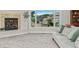Inviting living room featuring a cozy fireplace, plush carpet, and a large window with picturesque views of the mountains at 319 Camino Bosque, Boulder, CO 80302