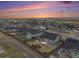 Aerial view of a residential neighborhood with fenced yards and mountain views at 11346 Kittredge St, Commerce City, CO 80022