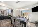 Bright dining room with sliding doors to a patio and open to the living room at 11346 Kittredge St, Commerce City, CO 80022