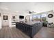 Spacious living room featuring a fireplace, built-in shelving, and ample natural light at 11346 Kittredge St, Commerce City, CO 80022
