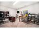 Well-lit office space with two desks, shelving and a neutral color scheme at 11346 Kittredge St, Commerce City, CO 80022