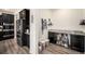 Walk-in pantry with ample storage space, shelving, and stylish countertops for organization at 11346 Kittredge St, Commerce City, CO 80022