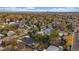 Scenic aerial view of a residential neighborhood with lush trees, showcasing the charm and community setting at 7911 Raleigh Pl, Westminster, CO 80030
