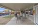 Inviting covered patio with a dining table and chairs, along with a mini fridge and grill for outdoor entertaining at 7911 Raleigh Pl, Westminster, CO 80030