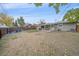 Expansive backyard with a cozy fire pit area, complemented by a well-manicured lawn and secure fencing at 7911 Raleigh Pl, Westminster, CO 80030