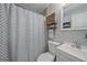 Charming bathroom featuring black and white shower curtain, vanity, and modern fixtures at 7911 Raleigh Pl, Westminster, CO 80030