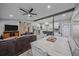 Inviting kitchen with stainless steel appliances, a center island, and a smooth transition to the living space at 7911 Raleigh Pl, Westminster, CO 80030