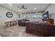 The living area features wood floors, and a table and chairs, with plenty of natural light at 7911 Raleigh Pl, Westminster, CO 80030