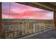 A balcony view shows the expansive cityscape and mountain view at 955 Eudora St # 1107, Denver, CO 80220