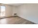 Bright bedroom with wood floors, neutral paint, and large windows, providing lots of natural light at 955 Eudora St # 1107, Denver, CO 80220