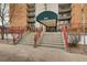 Inviting building entrance with grand steps and well-maintained landscaping, offering easy access to the property at 955 Eudora St # 1107, Denver, CO 80220