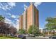 High rise building with balconies and mature trees at 955 Eudora St # 1107, Denver, CO 80220