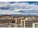 Scenic cityscape view of Denver, including mountains and buildings, with dynamic sky at 955 Eudora St # 1107, Denver, CO 80220