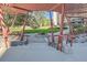 Outdoor common area with red pergola, stone walkways, and green grass at 955 Eudora St # 1107, Denver, CO 80220