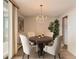 Dining area featuring a round table, chandelier, and comfortable chairs, perfect for entertaining guests at 955 Eudora St # 1107, Denver, CO 80220