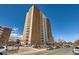 Brick apartment building with multiple balconies and parking at 955 Eudora St # 1107, Denver, CO 80220