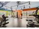Bright fitness center with modern gym equipment, bright lighting, and a colorful accent wall at 955 Eudora St # 1107, Denver, CO 80220