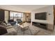 Inviting living room with large windows offering panoramic city views and comfortable seating at 955 Eudora St # 1107, Denver, CO 80220