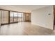 Bright living room with wood floors, large window and a chandelier at 955 Eudora St # 1107, Denver, CO 80220