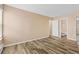 Bright bedroom with wood-look floors and access to bathroom at 10150 E Virginia Ave # 6-305, Denver, CO 80247