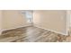 Bright bedroom with wood-look floors and window at 10150 E Virginia Ave # 6-305, Denver, CO 80247