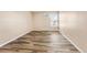 Bright bedroom with wood-look floors and window at 10150 E Virginia Ave # 6-305, Denver, CO 80247