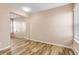 Bedroom with mirrored closet doors and wood-look floors at 10150 E Virginia Ave # 6-305, Denver, CO 80247