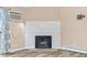 White tiled fireplace in living room at 10150 E Virginia Ave # 6-305, Denver, CO 80247